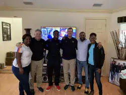 Michigan coaches Don Brown and Jim Harbaugh visit commit George Johnson and family