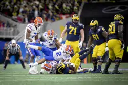 A Florida player puts a finishing move on Christian Turner