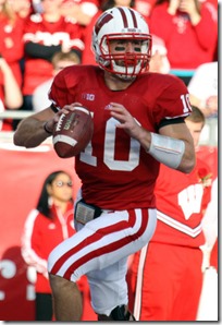 NNov 17, 2012; Madison, WI, USA; Wisconsin Badgers quarterback Curt Phillips (10) looks for a receiver as his team plays the Ohio State Buckeyes during the first half at Camp Randall Stadium.  Mandatory Credit: Mary Langenfeld-US PRESSWIRE
