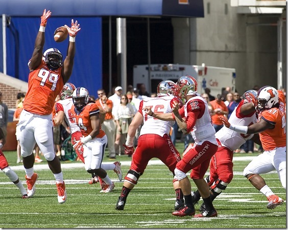 Sep 6, 2014; Champaign, IL, USA; Illinois Fighting Illini defensive lineman Jarrod Clements (99) blocks a pass in the game between the Illinois Fighting Illini and the Western Kentucky Hilltoppers at Memorial Stadium.  Illinois beat Western Kentucky 42-34. Mandatory Credit: Mike Granse-USA TODAY Sports