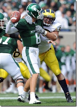 Michigan's Ryan Van Bergen, #53, hauls down Michigan State University quarterback Kirk Cousins during secind quarter action of Saturday afternoon, October 3rd's clash between the in-state rivals at Spartan Stadium in East Lansing. 
Lon Horwedel | AnnArbor.com