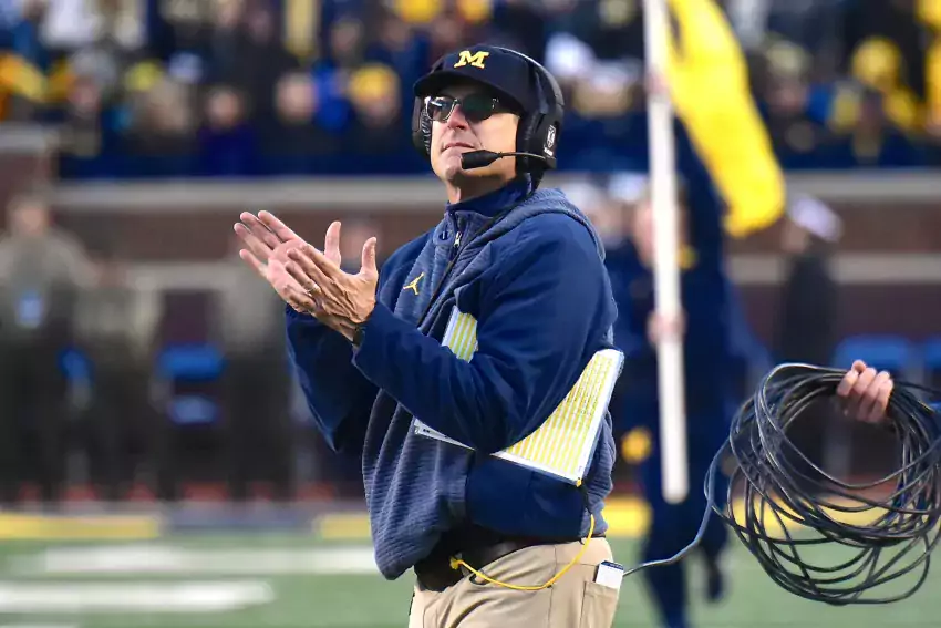 Jim Harbaugh took a phone call in the middle of his press conference Saturday