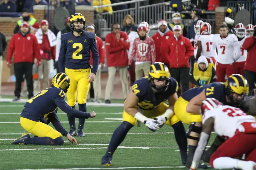 Jake Mood attempts one of his record-breaking six field goal completions against Indiana