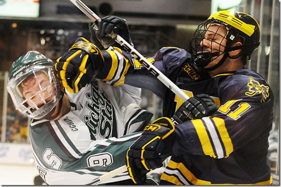 Michigan forward Kevin Lynch (#11) plays against Michigan State in the CCHA tournament on Saturday, March 13, 2010 at Munn Ice Arena in East Lansing.  The Wolverines won 5-3. (ARIEL BOND/Daily) 