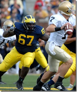  DT Terrance Taylor (67), DT John Ferrara (94), and DE Brandon Graham (65) pressure Irish QB Jimmy Clausen (7) during Michigan's 38-0 win over Notre Dame on Saturday, September 15, 2007 at Michigan Stadium. (RODRIGO GAYA/ Daily).