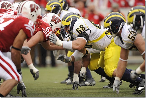 (caption) Wisconsin center Gabe Carimi knocks heads with Michigan defensive tackle Mike Martin across the line of scrimmage in the second half.  ***  For the fourth week in a row, Michigan's defense gave up too many points in the second half, as the Wisconsin Badgers rolled to a 45-24 victory over the Wolverines at Camp Randall Stadium in Madison Wisconsin. The loss, Michigan's sixth straight in the Big Ten, drops the Wolverines to 5-6 overall, after starting the season 4-0.  Photos taken on Saturday, November 14, 2009.   ( John T. Greilick / The Detroit News )

