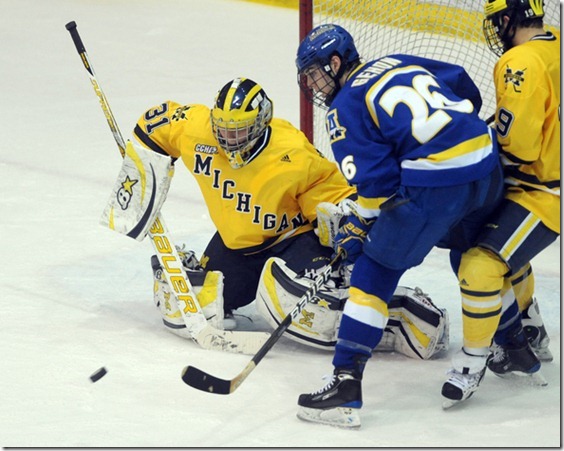 Michigan goalie Shawn Hunwick tries to keep Alaska Fairbank's Chad Gehon, right, from scoring during second period action of Saturday, Janaury 22nd's clash between the two teams at UM's Yost Ice Arena.
Lon Horwedel | AnnArbor.com