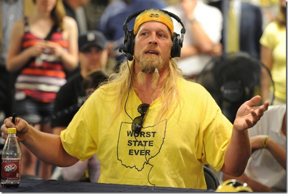 Former Michigan football player Steve Everitt talks on the radio at the M-Den during the WTKA Mott Takeover fundraising event.  Angela J. Cesere | AnnArbor.com